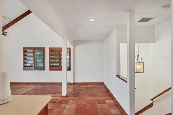 a view of a hallway with windows