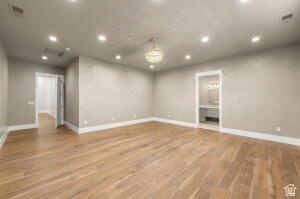 1141 East Lost Ridge Drive Washington, UT 84780 - Photo 81 of 108 Spacious room featuring wood-finish flooring, recessed lighting, and a decorative chandelier