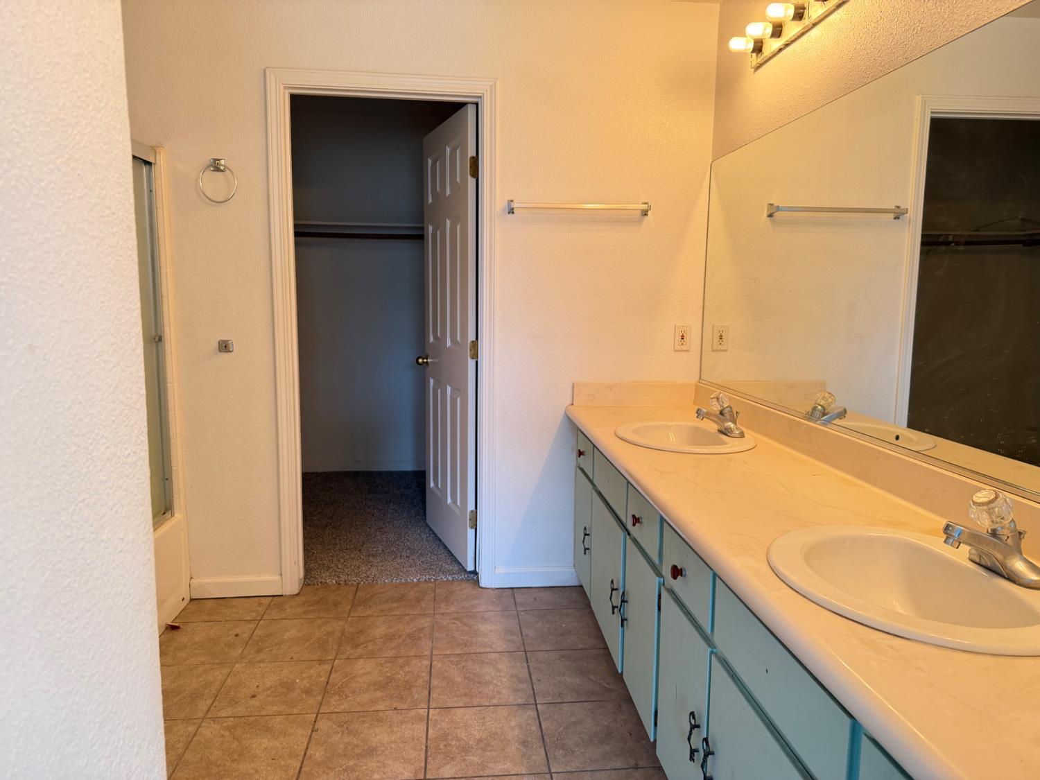 946 West Mammoth Pool Way Hanford, CA 93230 - Photo 2 of 17 a bathroom with a double vanity sink and mirror