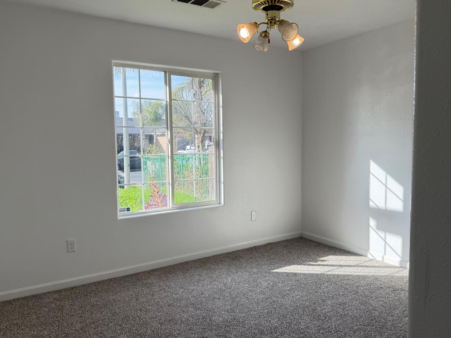 946 West Mammoth Pool Way Hanford, CA 93230 - Photo 3 of 17 an empty room with a window