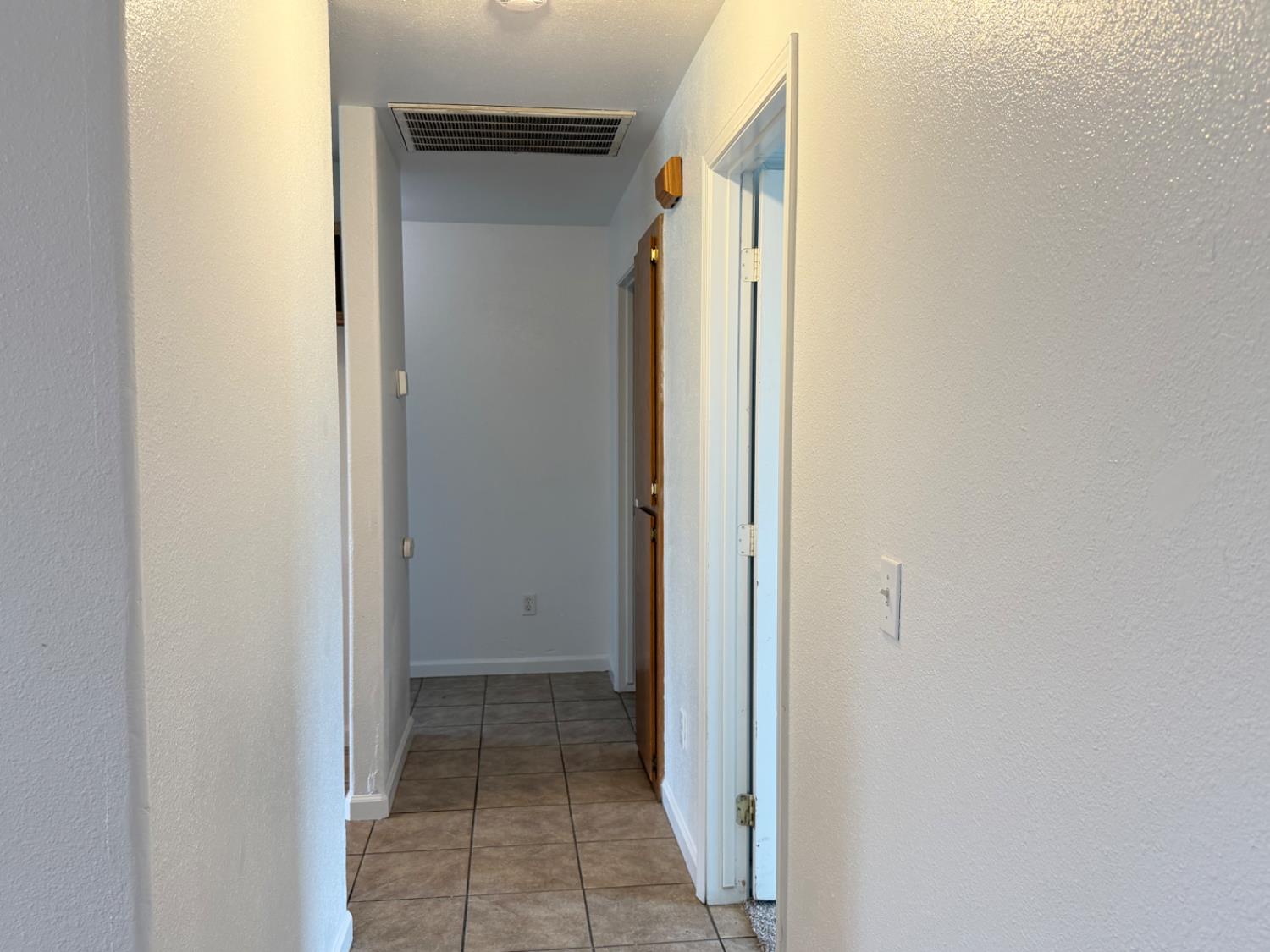 946 West Mammoth Pool Way Hanford, CA 93230 - Photo 9 of 17 a view of a hallway