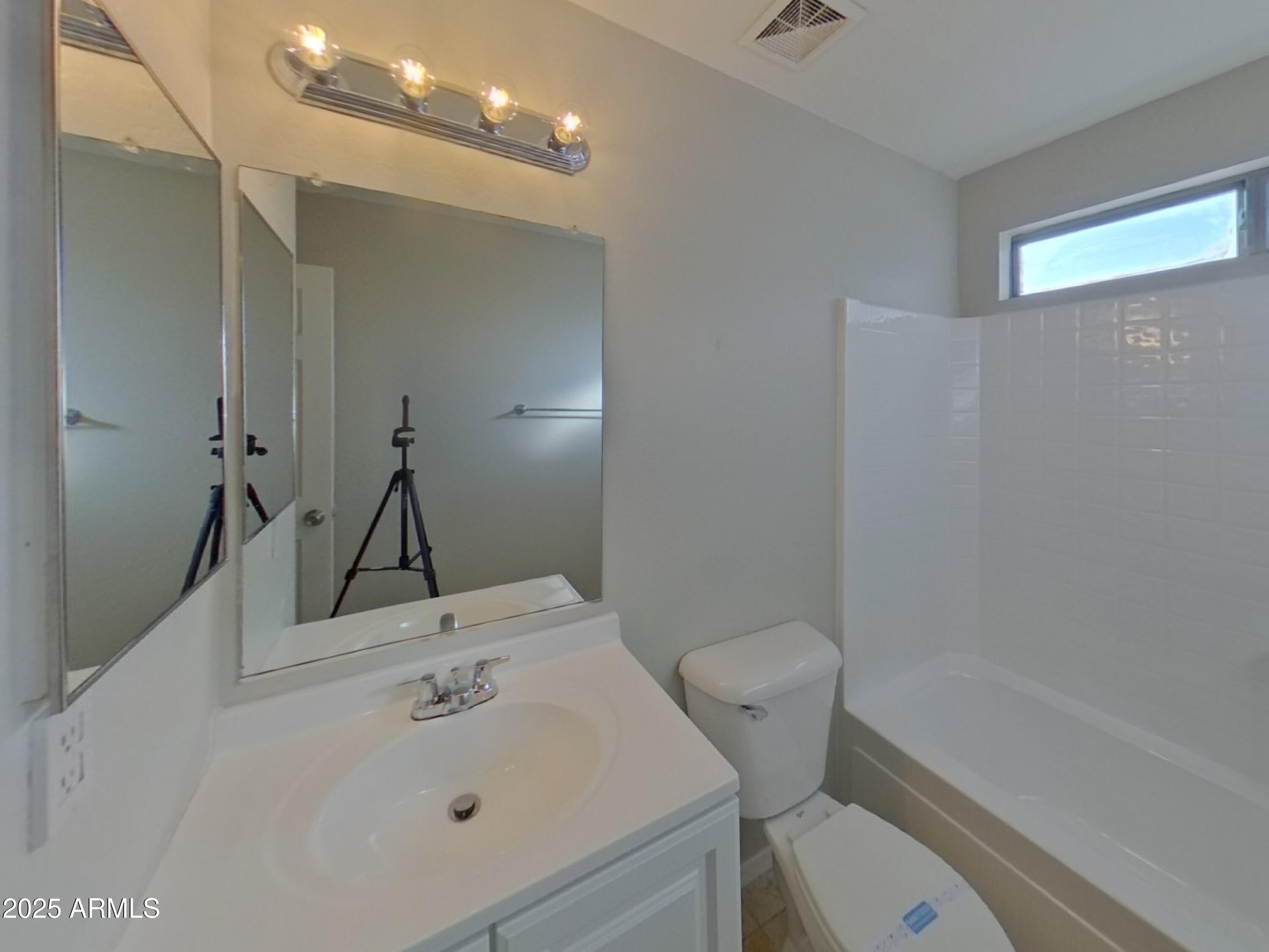 19303 North Leland Road Maricopa, AZ 85138 - Photo 13 of 16 a bathroom with a sink a toilet and shower