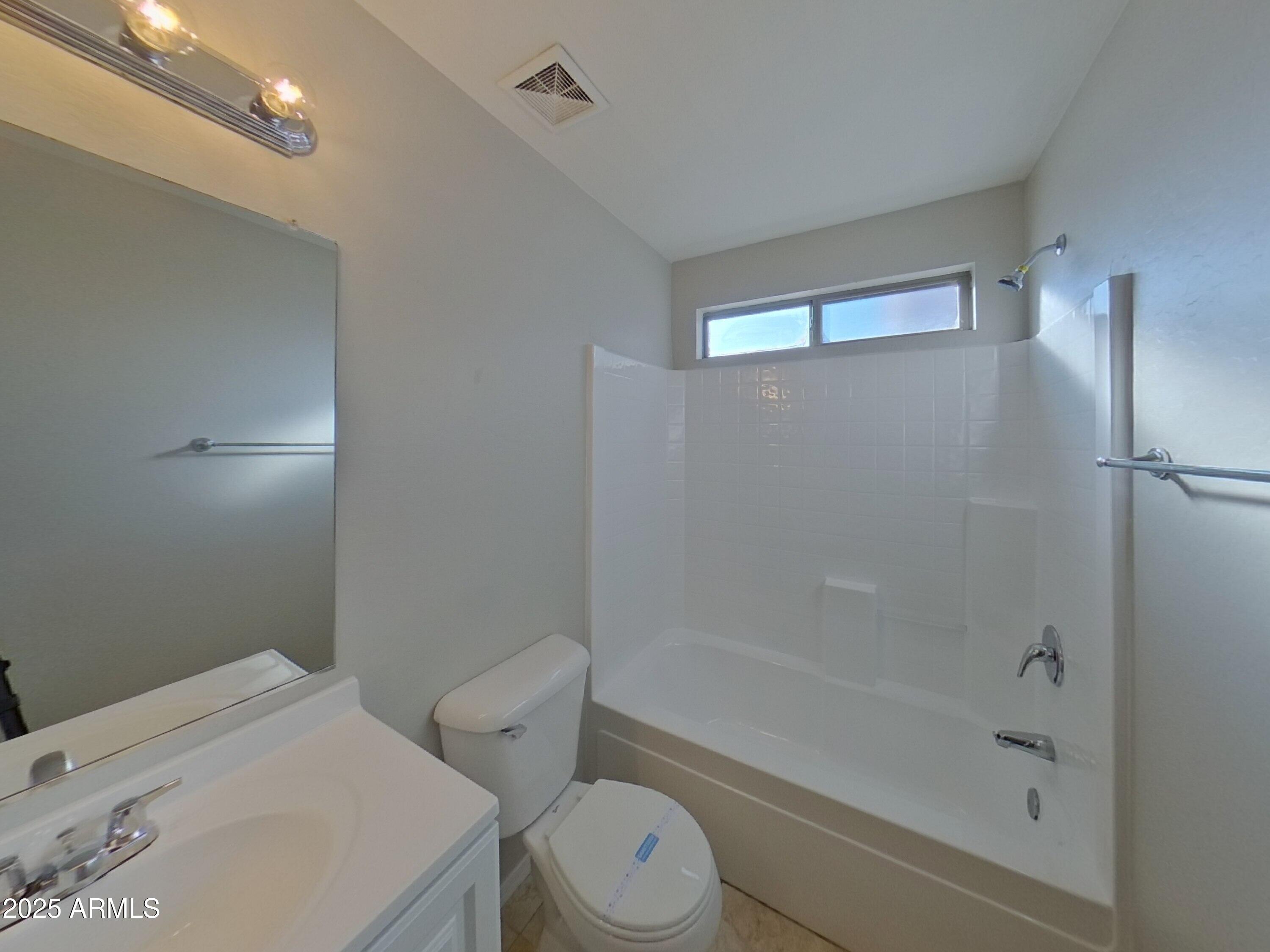 19303 North Leland Road Maricopa, AZ 85138 - Photo 14 of 16 a bathroom with a toilet and a shower