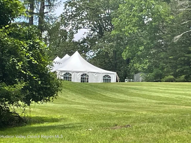 a bedroom with a bed and a fireplace