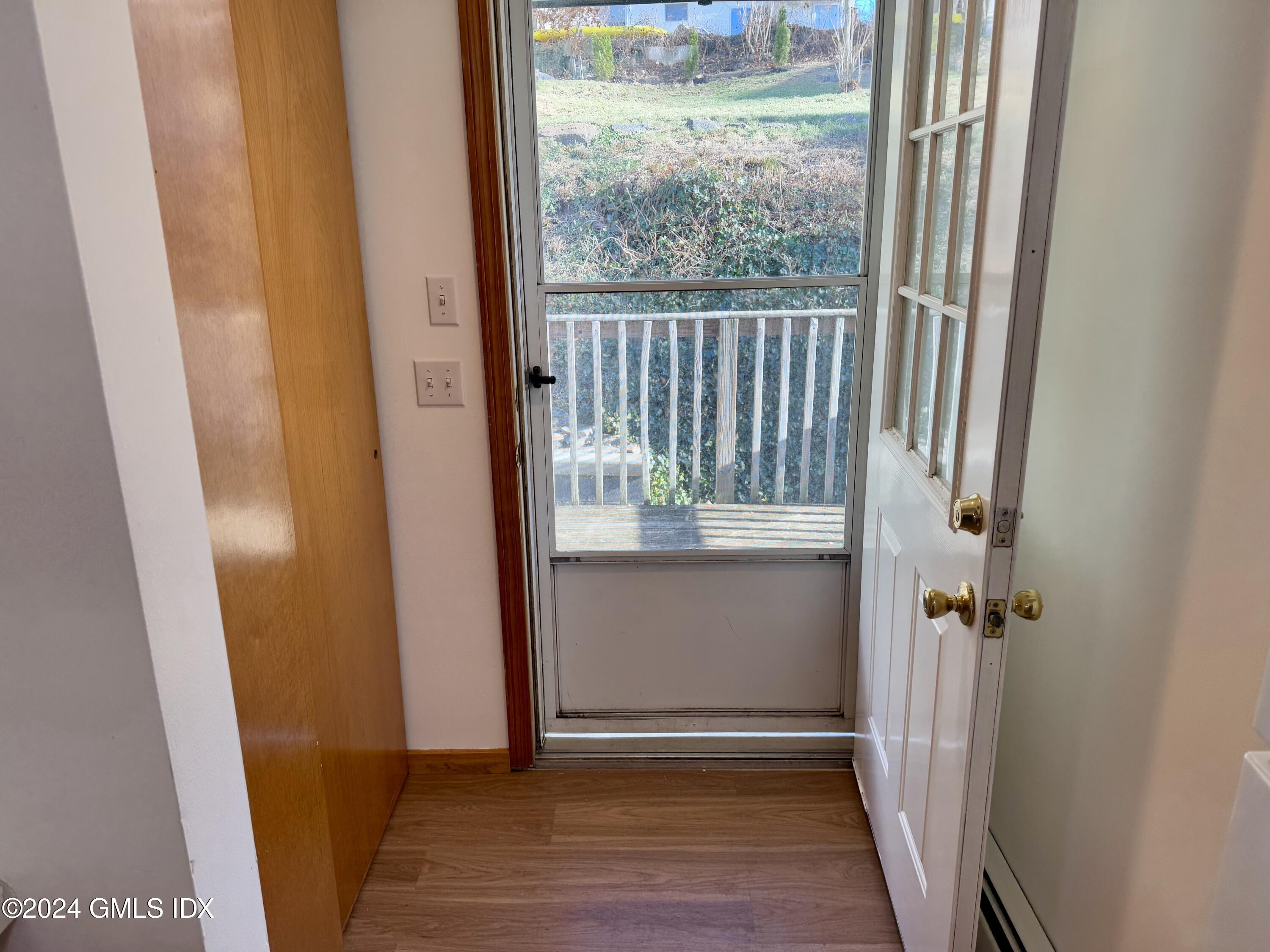 137 South Water Street, Unit 1B Greenwich, CT 06830 - Photo 12 of 13 a view of entryway with wooden floor