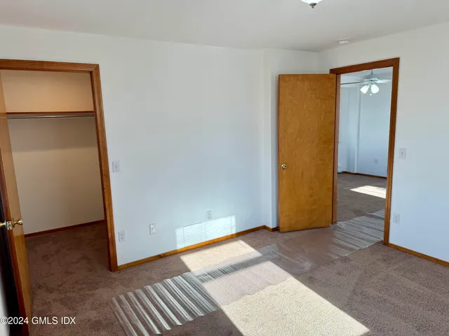 a bathroom with a shower a toilet and a sink