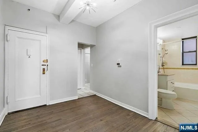 a view of a bathroom with wooden floor