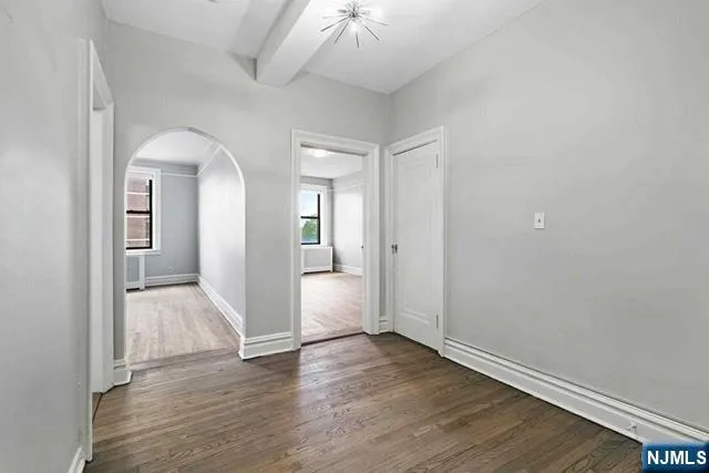 a view of entryway with wooden floor