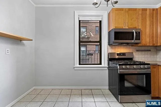 a kitchen with a stove and a microwave