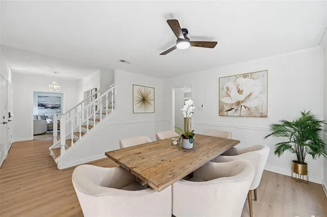 a view of dining room and hall with wooden floor