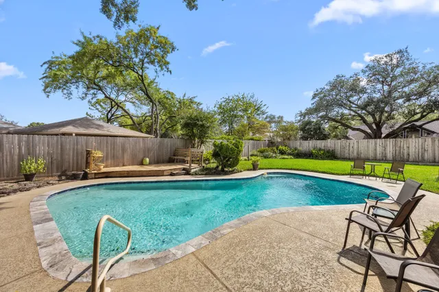a view of swimming pool with patio