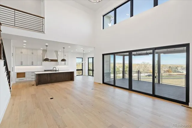 a view of a kitchen with large windows