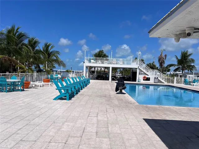 a view of a swimming pool with a patio