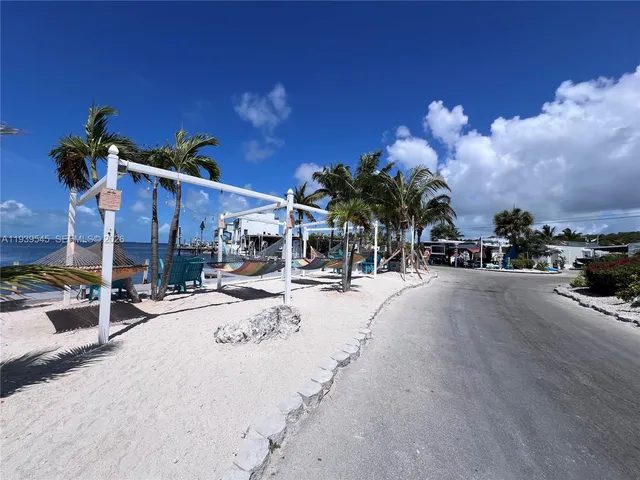 a view of a street with a building in the background