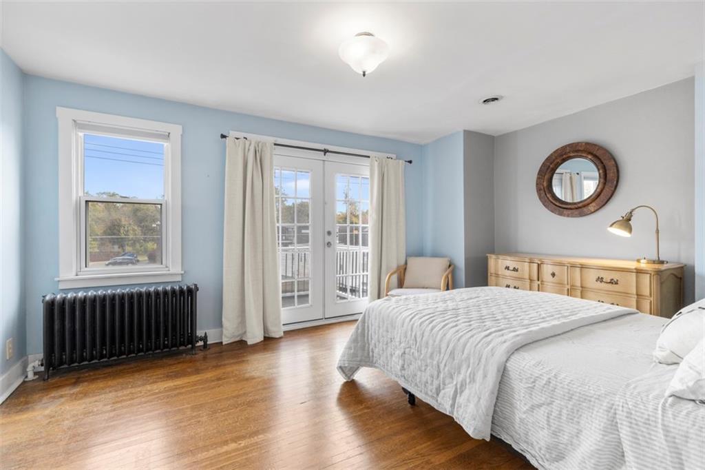 1141 Chislett Street Pittsburgh, PA 15206 - Photo 12 of 34 a bedroom with a bed and a window