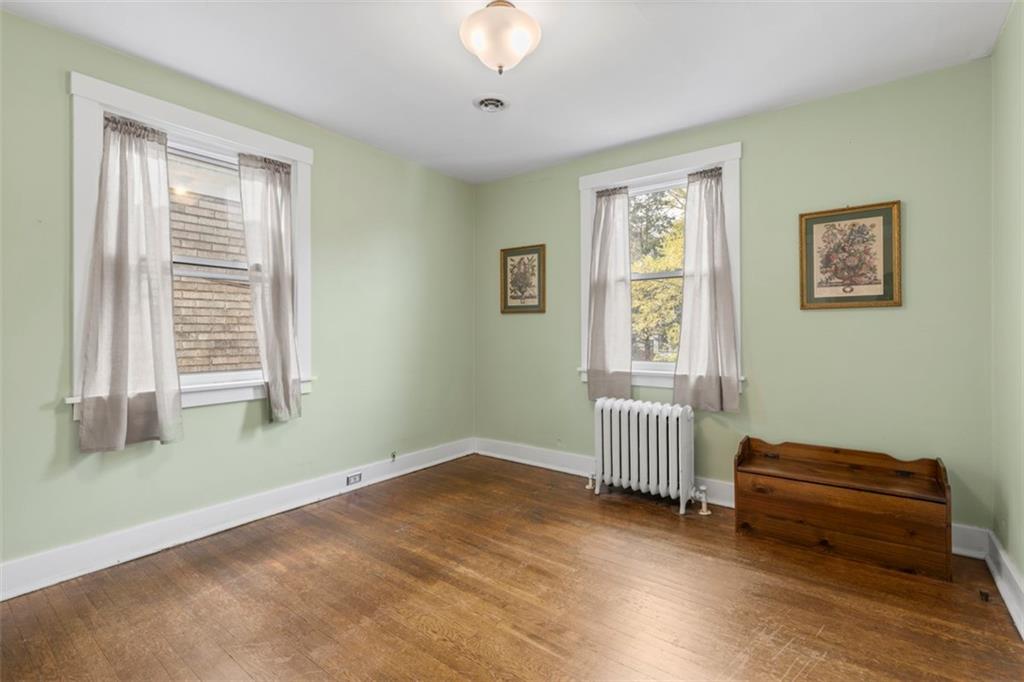 1141 Chislett Street Pittsburgh, PA 15206 - Photo 17 of 34 a view of a livingroom with furniture wooden floor and window