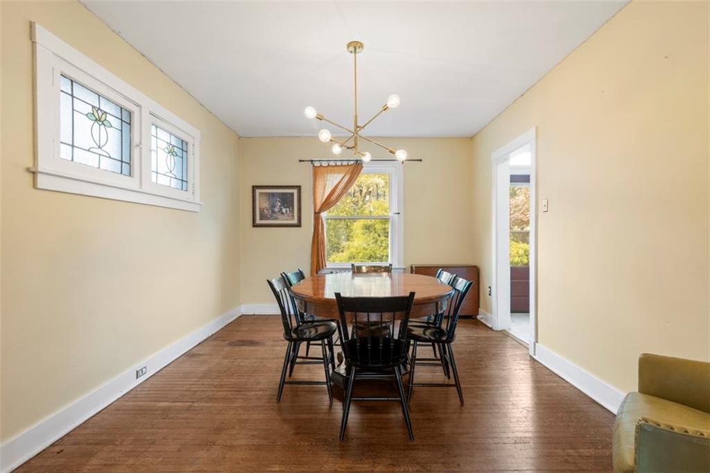 1141 Chislett Street Pittsburgh, PA 15206 - Photo 6 of 34 a view of a dining room with furniture window and wooden floor