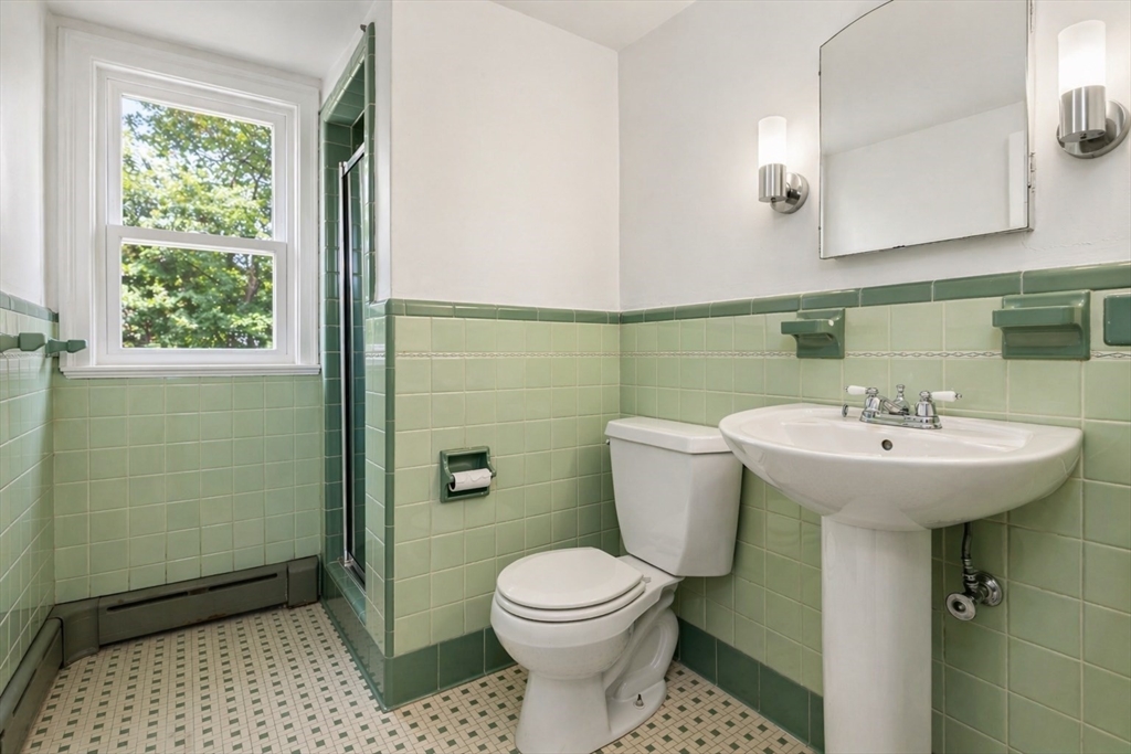 29 Boulevard Road Dedham, MA 02026 - Photo 23 of 34 a bathroom with a sink a toilet and shower