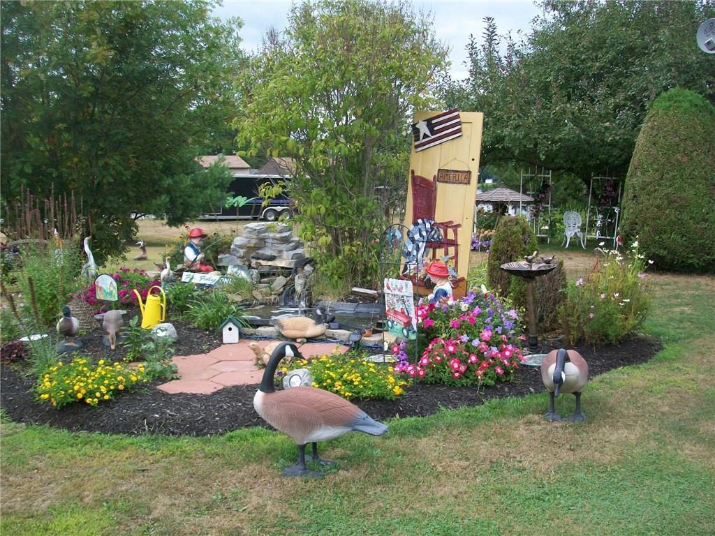 85 River Road Howland, ME 04448 - Photo 2 of 32 Beautiful landscaping!