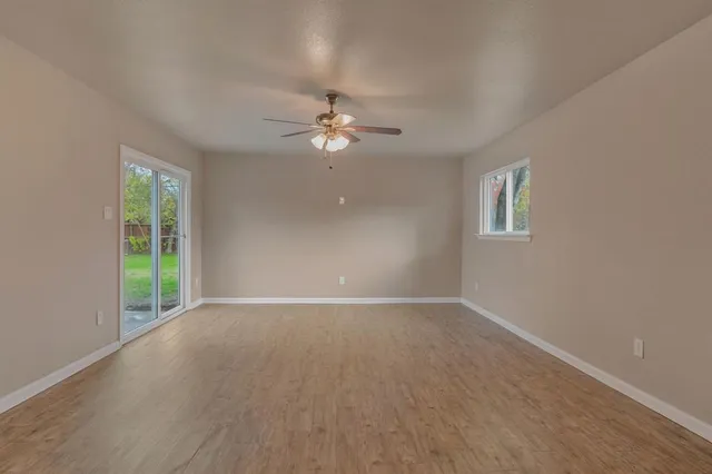 a view of an empty room with a window