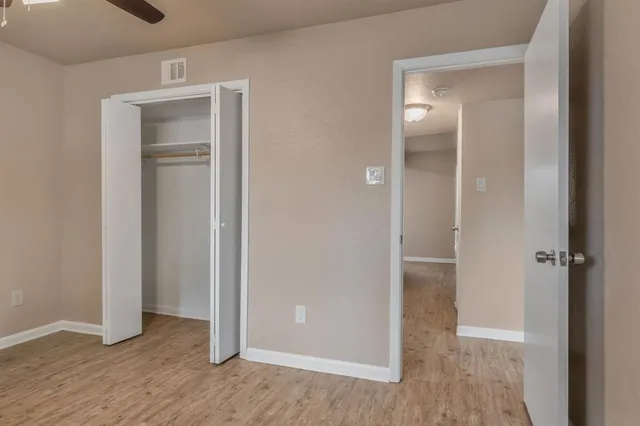 an empty room and closet area