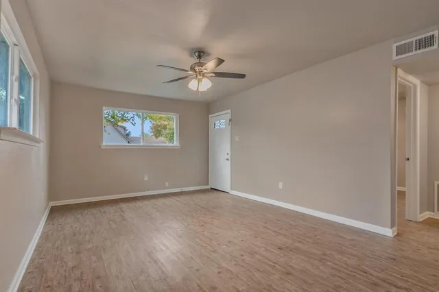 a view of an empty room with a window