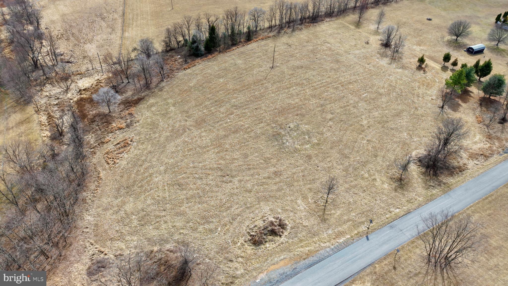 Lot 4 Galloway Road Martinsburg, WV 25403 - Photo 17 of 17 a view of a dry yard with wooden fence