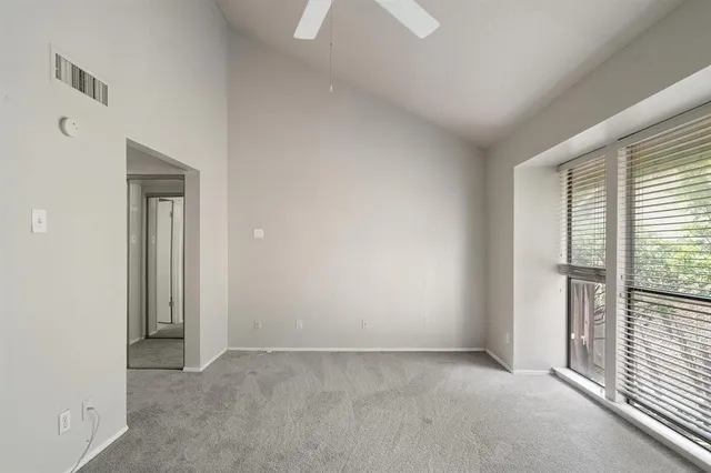 an empty room that has a window