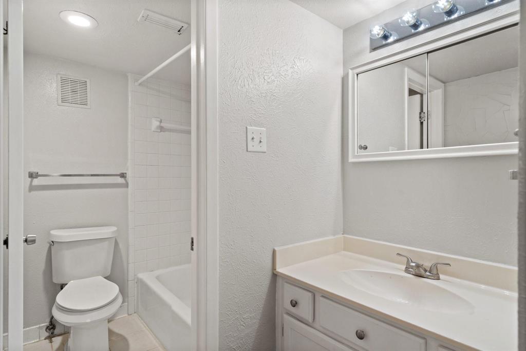 4543 North O'Connor Road, Unit 1247 Irving, TX 75062 - Photo 17 of 25 a bathroom with a sink vanity and toilet
