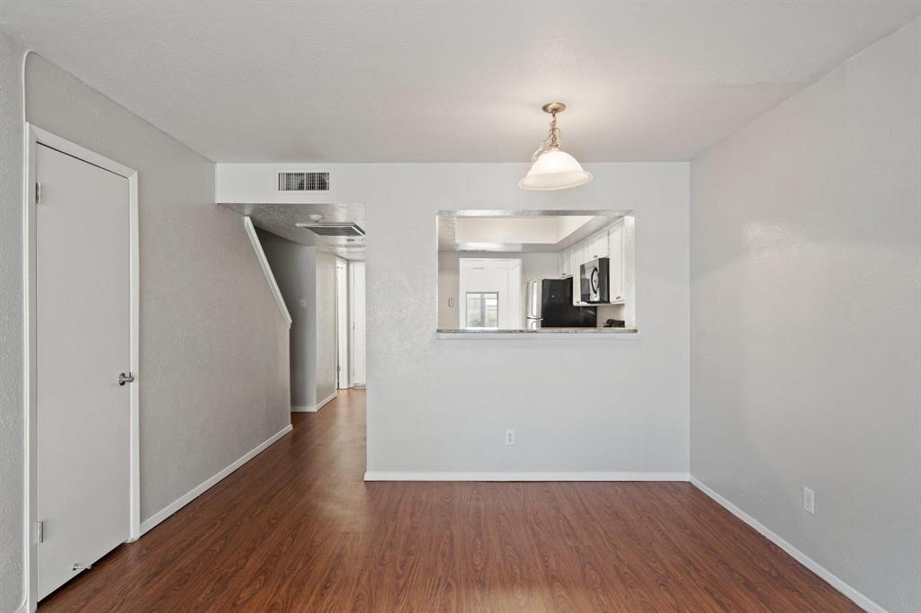4543 North O'Connor Road, Unit 1247 Irving, TX 75062 - Photo 6 of 25 a view of a hallway with wooden floor and a room