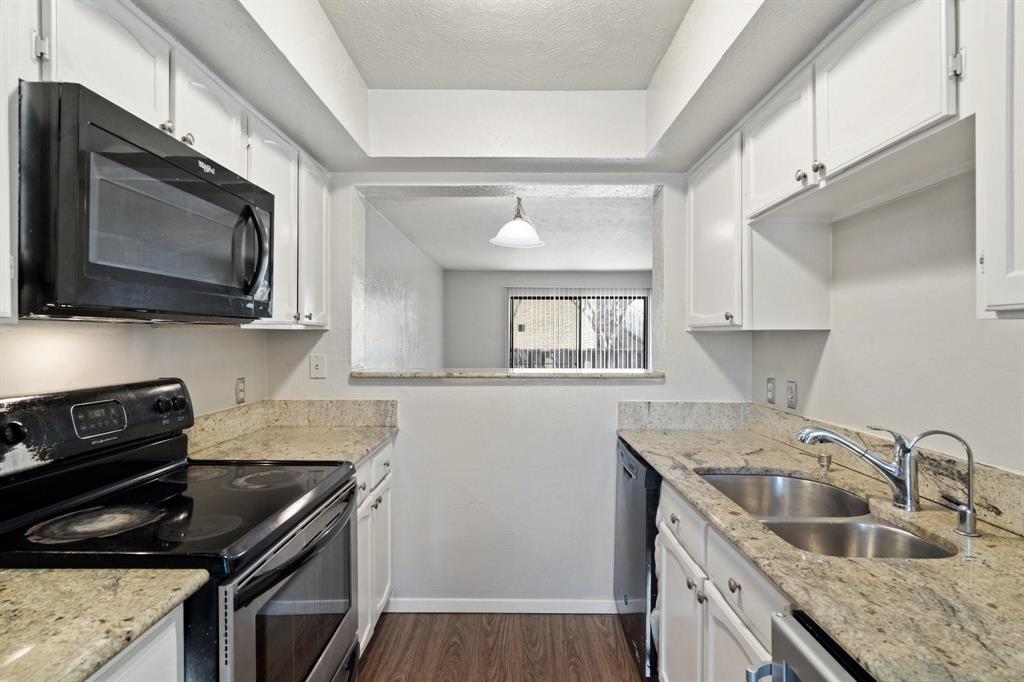 4543 North O'Connor Road, Unit 1247 Irving, TX 75062 - Photo 8 of 25 a kitchen that has a sink and a stove
