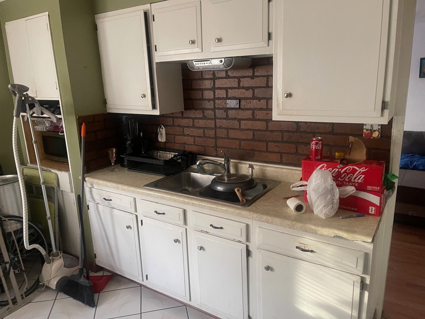 4719 South Kilpatrick Avenue Chicago, IL 60632 - Photo 2 of 7 a kitchen with white cabinets and appliances