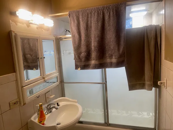a bathroom with a sink and mirror