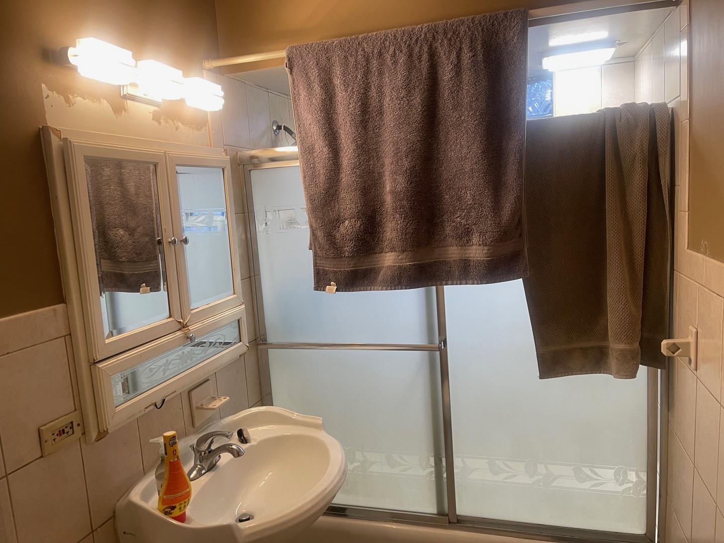 4719 South Kilpatrick Avenue Chicago, IL 60632 - Photo 5 of 7 a bathroom with a sink and mirror