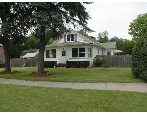 2146 Wilbraham Road Springfield, MA 01129 - Photo 1 of 8 a front view of a house with a yard and trees
