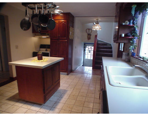 2146 Wilbraham Road Springfield, MA 01129 - Photo 2 of 8 a bathroom with a sink and a mirror