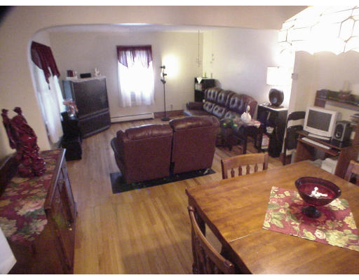 2146 Wilbraham Road Springfield, MA 01129 - Photo 3 of 8 a living room with furniture and a flat screen tv