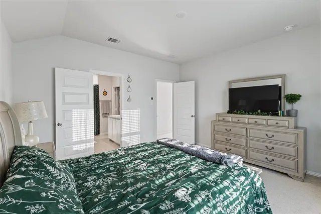 a view of room with window and flat screen tv