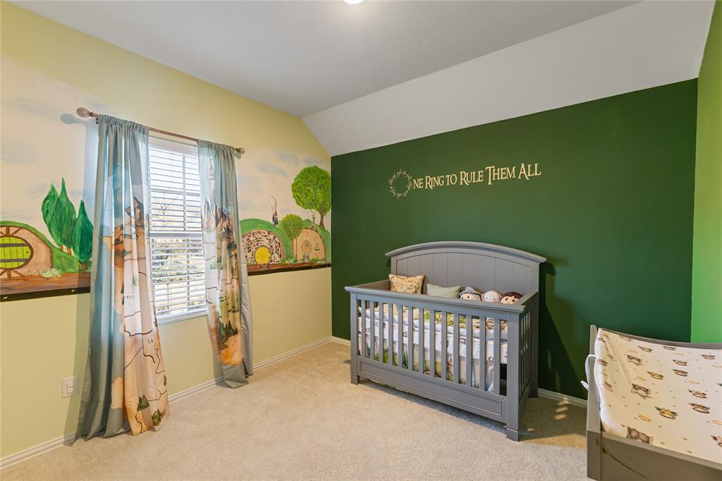 2404 Atlantic Avenue Anna, TX 75409 - Photo 16 of 26 a view of a bedroom with furniture and staircase