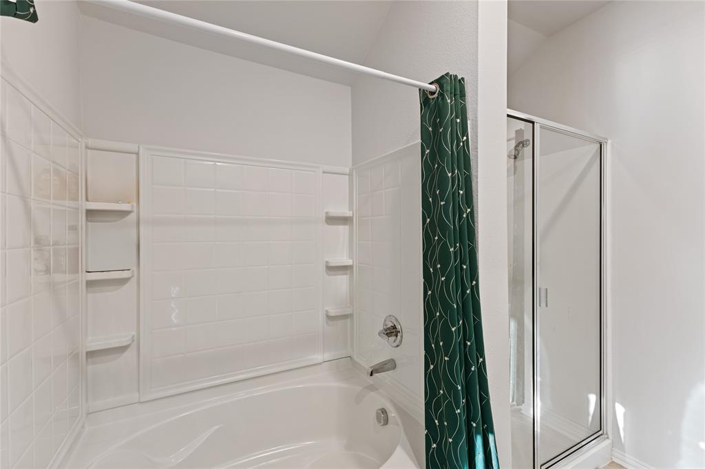 2404 Atlantic Avenue Anna, TX 75409 - Photo 22 of 26 a bathroom with a bathtub