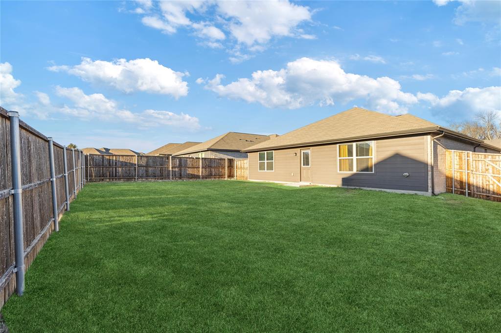 2404 Atlantic Avenue Anna, TX 75409 - Photo 24 of 26 a view of an house with backyard space and garden