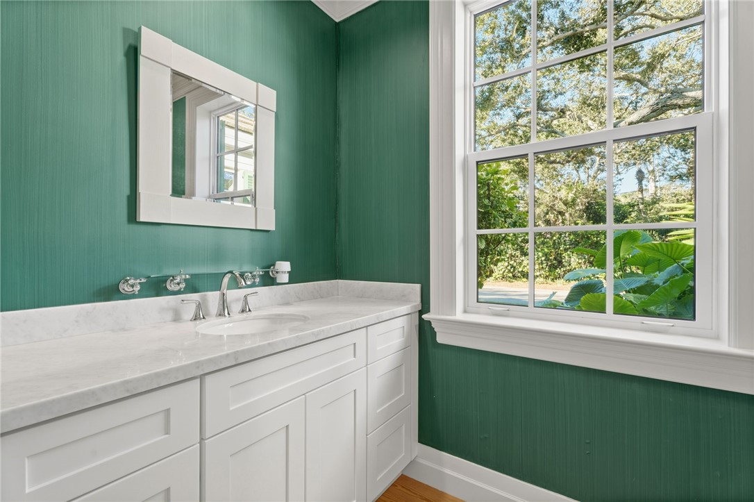 201 Sundial Court Vero Beach, FL 32963 - Photo 23 of 35 a bathroom with a sink and a window