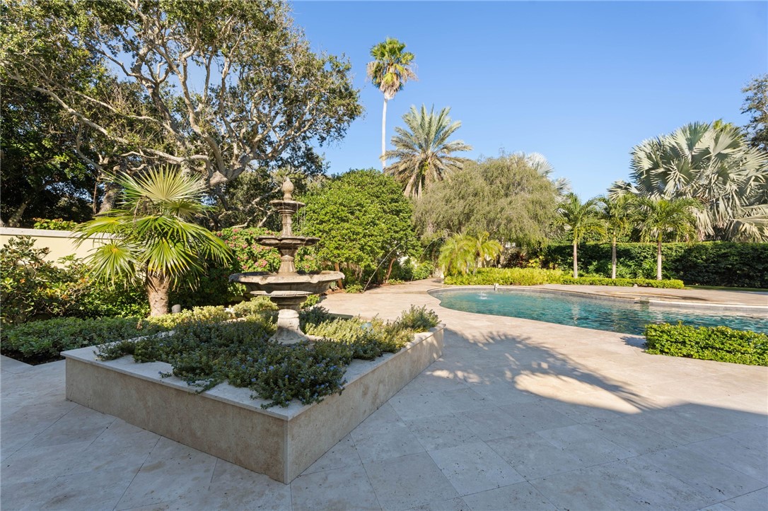201 Sundial Court Vero Beach, FL 32963 - Photo 29 of 35 a view of a garden with a bench