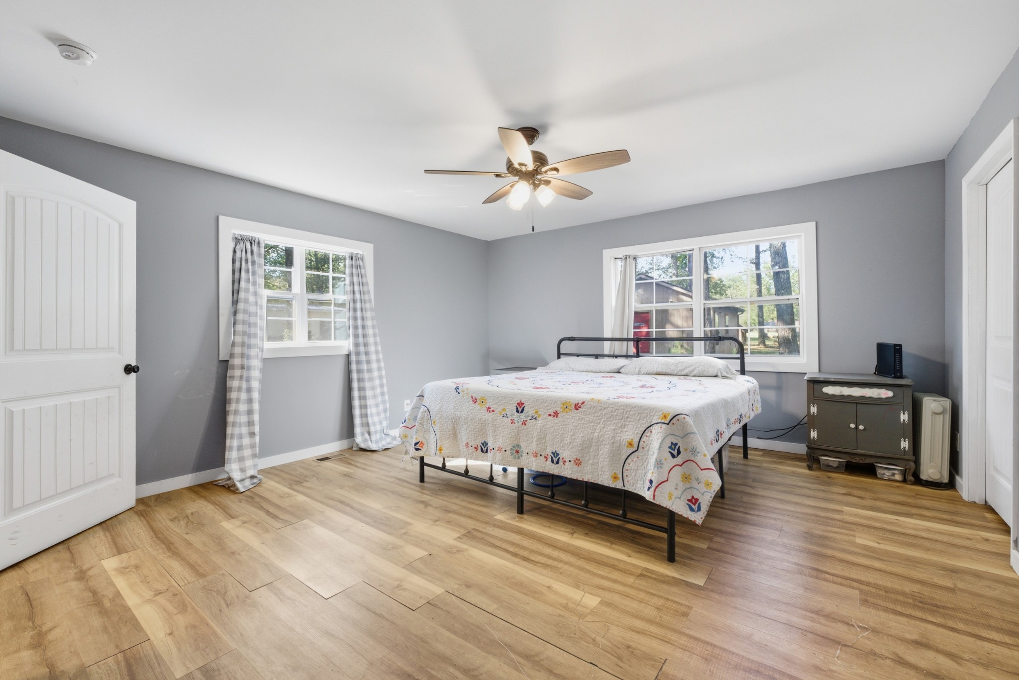 240 Myers Road Winchester, TN 37398 - Photo 17 of 38 a spacious bedroom with a bed a dresser and a window