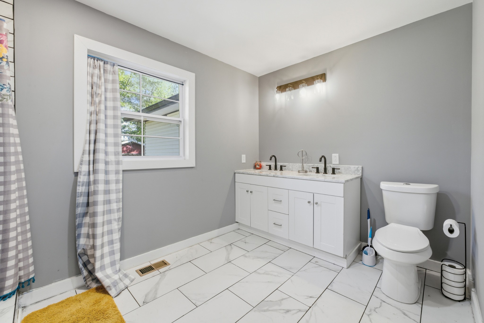240 Myers Road Winchester, TN 37398 - Photo 19 of 38 a spacious bathroom with a toilet sink and mirror