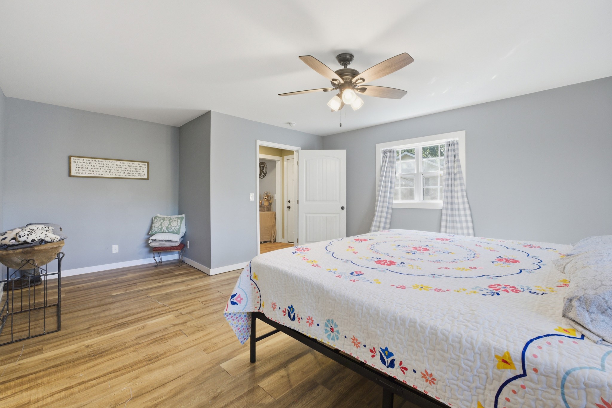 240 Myers Road Winchester, TN 37398 - Photo 21 of 38 a bedroom with a bed and a chandelier