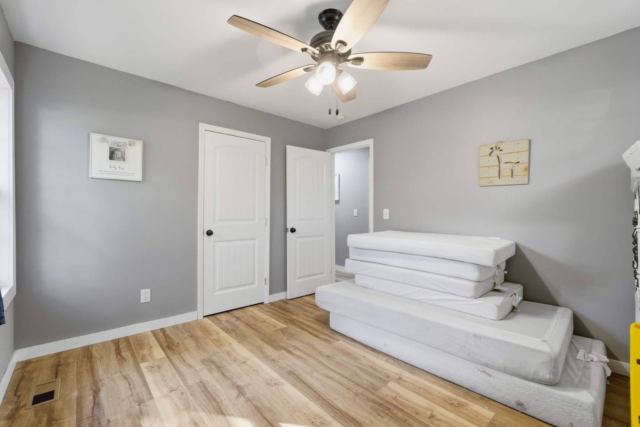 240 Myers Road Winchester, TN 37398 - Photo 28 of 38 a spacious bedroom with a bed and a chandelier