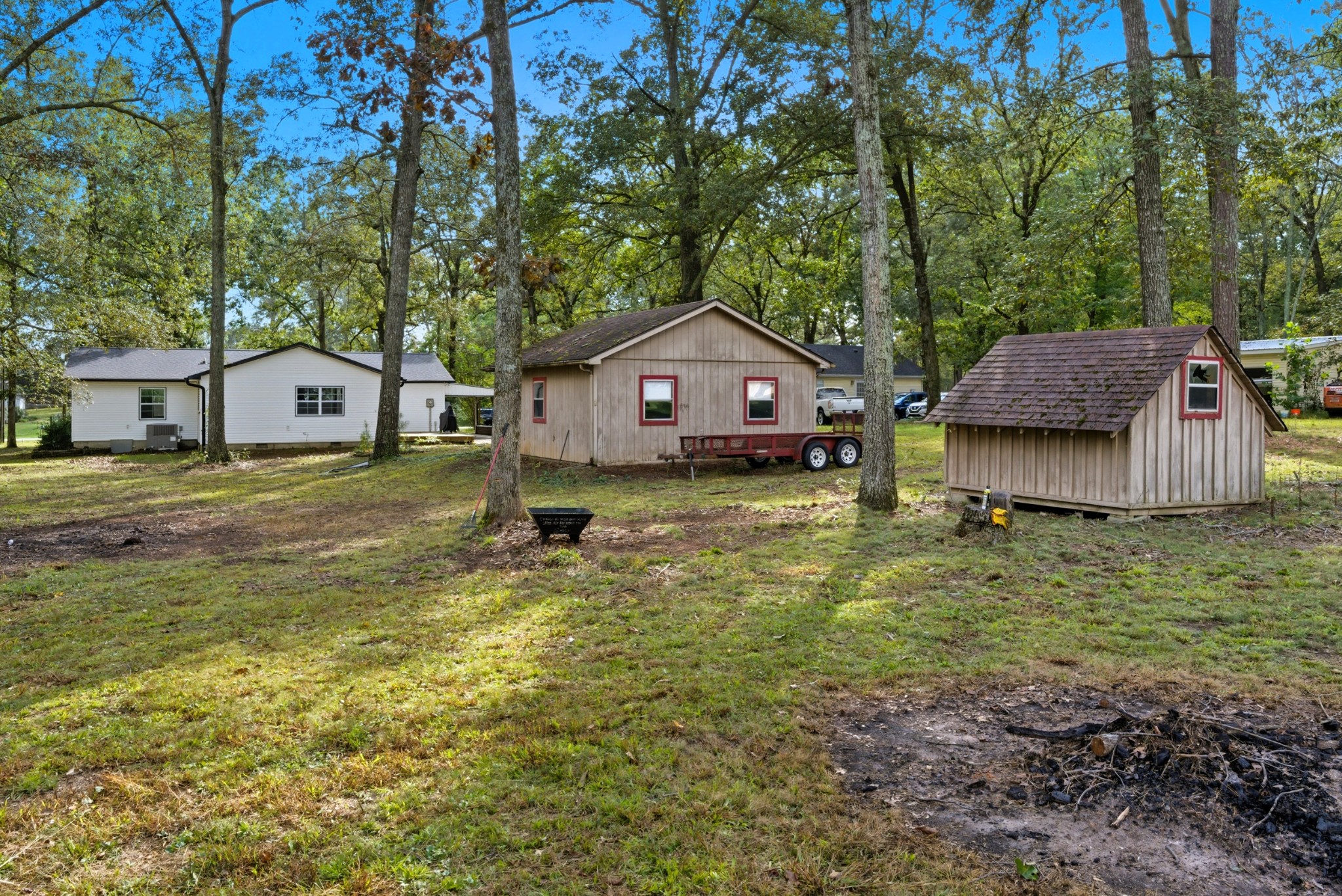 240 Myers Road Winchester, TN 37398 - Photo 36 of 38 a front view of a house with a yard garage and outdoor seating