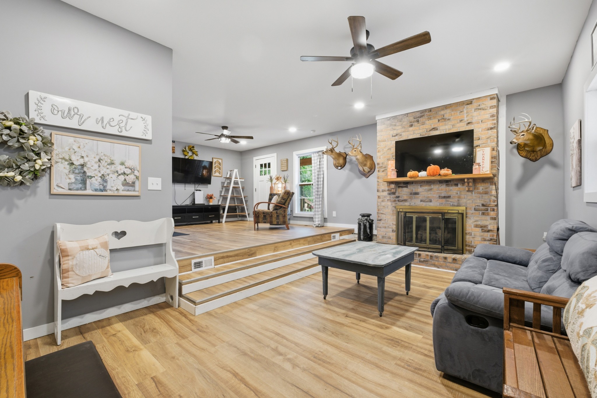 240 Myers Road Winchester, TN 37398 - Photo 6 of 38 a living room with furniture a fireplace and a flat screen tv