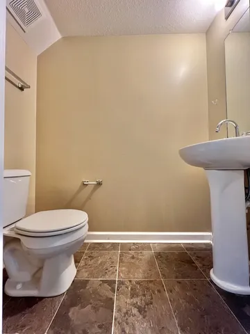 a bathroom with a toilet and a sink